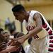 Milan player Gage Smith celebrates with teammates after getting to the bench on Monday, March 11. Daniel Brenner I AnnArbor.com